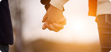 Couple holding hands