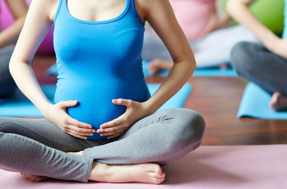 Group of pregnant women taking part in a yoga class